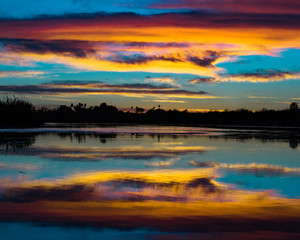 colorful clouds spreading across the colorado river