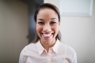 Portrait of smiling young female physiotherapist