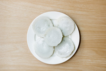 kind of Thai sweetmeat. coconut milk custard in small porcelain cup.