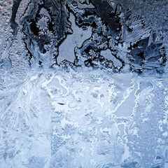 Ice flowers on glass - texture and background
