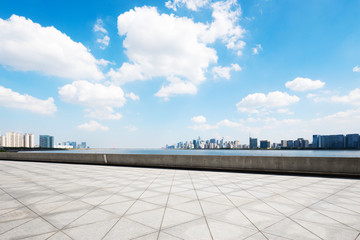 empty marble floor with cityscape of modern city