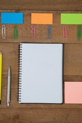 Various school supplies arranged on wooden table