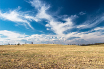 Beautiful clouds on the autumn field