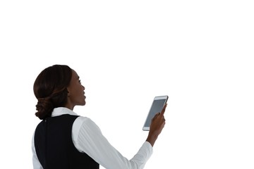 Side view of woman using tablet computer