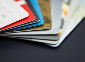 Stack of multicolored credit cards close-up	
