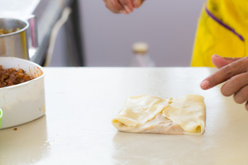 Thai street food of merchant making delicious hot roti for customers