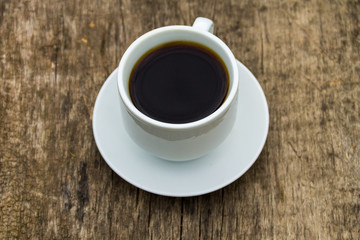 Cup of coffee on wooden table