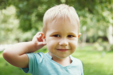 Little boy having fun playing in the Park on the grass