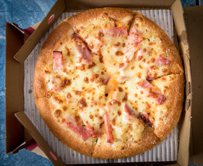 Hawaiian Pizza with bacon sweet pineapple and cheese.