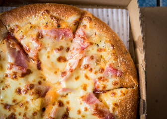 Hawaiian Pizza with bacon sweet pineapple and cheese.