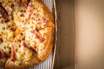 Hawaiian Pizza with bacon sweet pineapple and cheese.