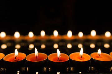 Many burning candles with shallow depth of field
