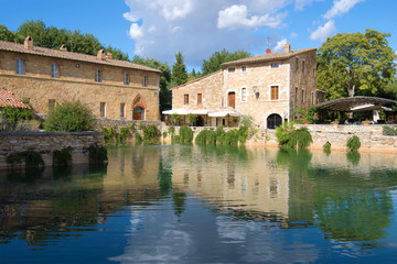 Fototapeta na wymiar A sunny day by the ancient thermal pool in Bagno Vignoni. Tuscany, Italy