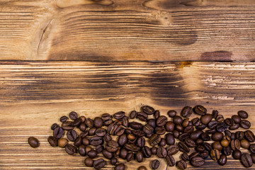 Coffee beans on wooden background