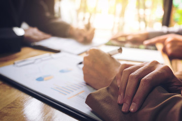 Co working conference, Business team meeting present, investor colleagues discussing new plan financial graph data on office table with laptop and digital tablet, Finance, accounting, investment