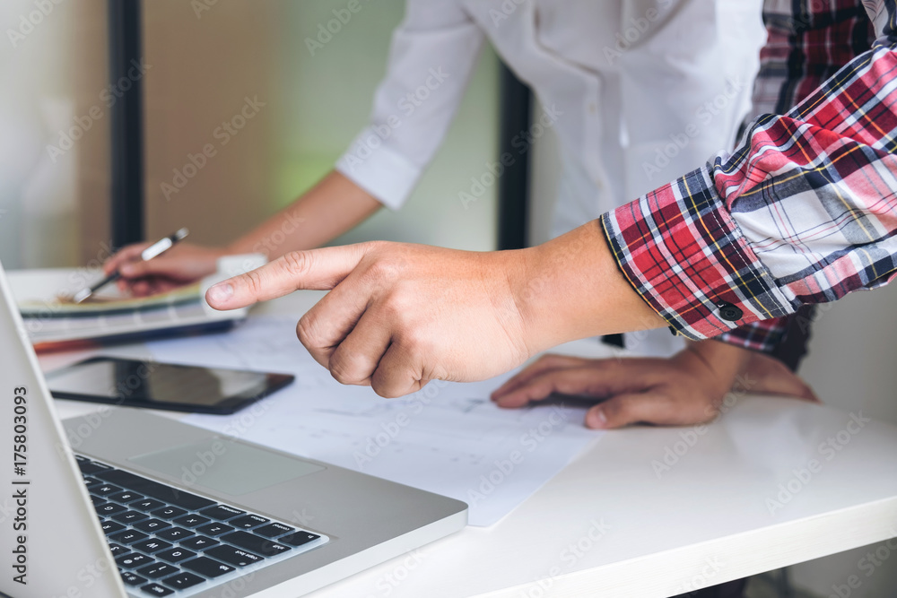 Aufkleber Two interior design or graphic designer at work on project of architecture drawing with work tools and color swatches, colour chart, color samples for selection, renovation and technology concept
