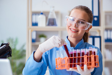 Female scientist researcher conducting an experiment in a labora