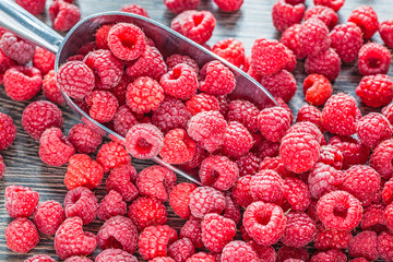 Ripe raspberry scoop healthy food concept