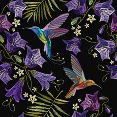 Embroidery violet flowers bells and humming bird seamless pattern. Beautiful violet cornflowers and humming bird, classical embroidery pattern. Fashionable template for design of clothes