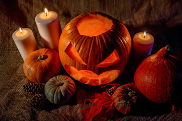 Obraz na płótnie Canvas Halloween pumpkin head with burning candles