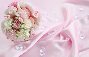 Tender bouquet on white silk. Space for text