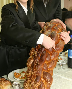 ceremony of cutting a hala at a bar mitzvah celebration

