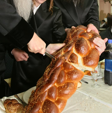 ceremony of cutting a hala at a bar mitzvah celebration

