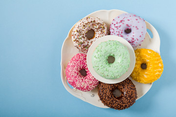 Colorful donuts on a blue background.