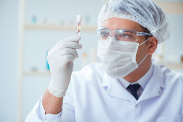 Chemist mixing perfumes in the lab