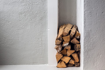 Interior firewood storage, Stack of firewood / woodpile in the room indoor.