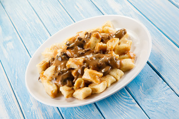 Potato noodles - dumplings on wooden background 
