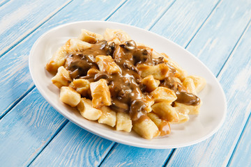 Potato noodles - dumplings on wooden background 