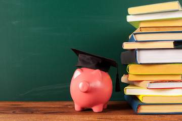 Study theme with pink piggy bank with chalkboard © fotofabrika