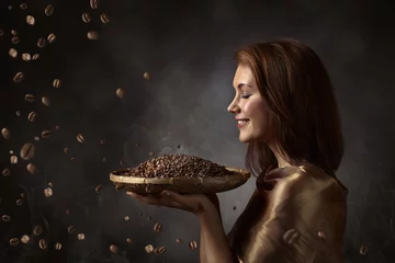 Zelfklevend Fotobehang Happy woman with roasted coffee beans . © Igor Normann