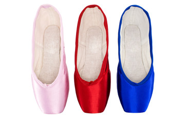 Blue, red and pink ballet pointe on white background