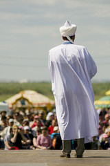 Rear view of preacher speaking in front of public