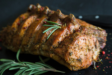 Pork loin on bone baked with herbs