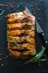 Pork loin on bone baked with herbs