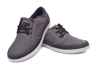 Pair of stylish grey sneakers isolated on white background with clipping path.