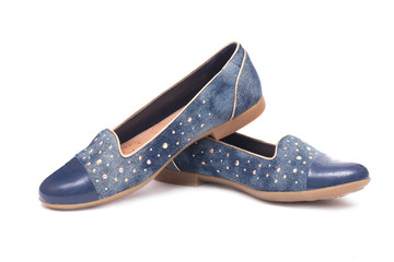 Pair of denim woman shoes isolated on white background.