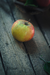 Fresh apple on an old wooden table.