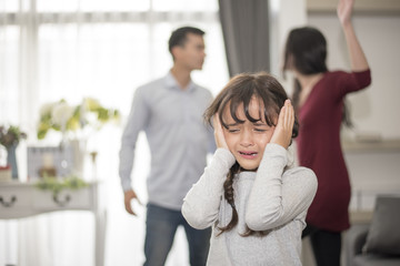 Little girl was crying because dad and mom quarrel, Sad and dramatic scene, Family issued,...