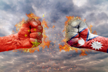 Two fist with the flag of China and Nepal faced at each other ready for fight