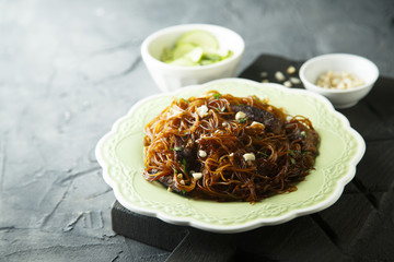 Rice noodles with soy sauce, peanuts and cucumber salad