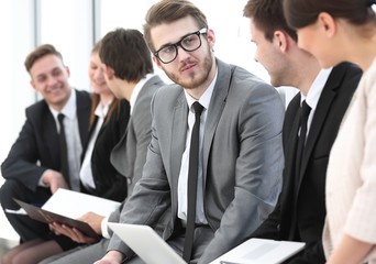 employee with colleagues before the briefing