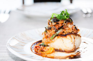 Grilled cod fish with vegetable and balsamic sauce