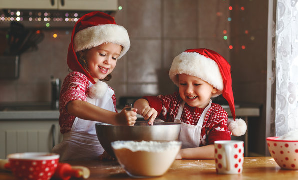 happy children bake christmas cookies.