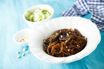Rice noodles with soy sauce, peanuts and cucumber salad