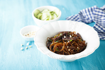 Rice noodles with soy sauce, peanuts and cucumber salad