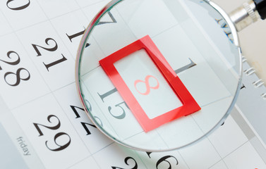 Fototapeta premium Calendar page with marked date of International Women's Day